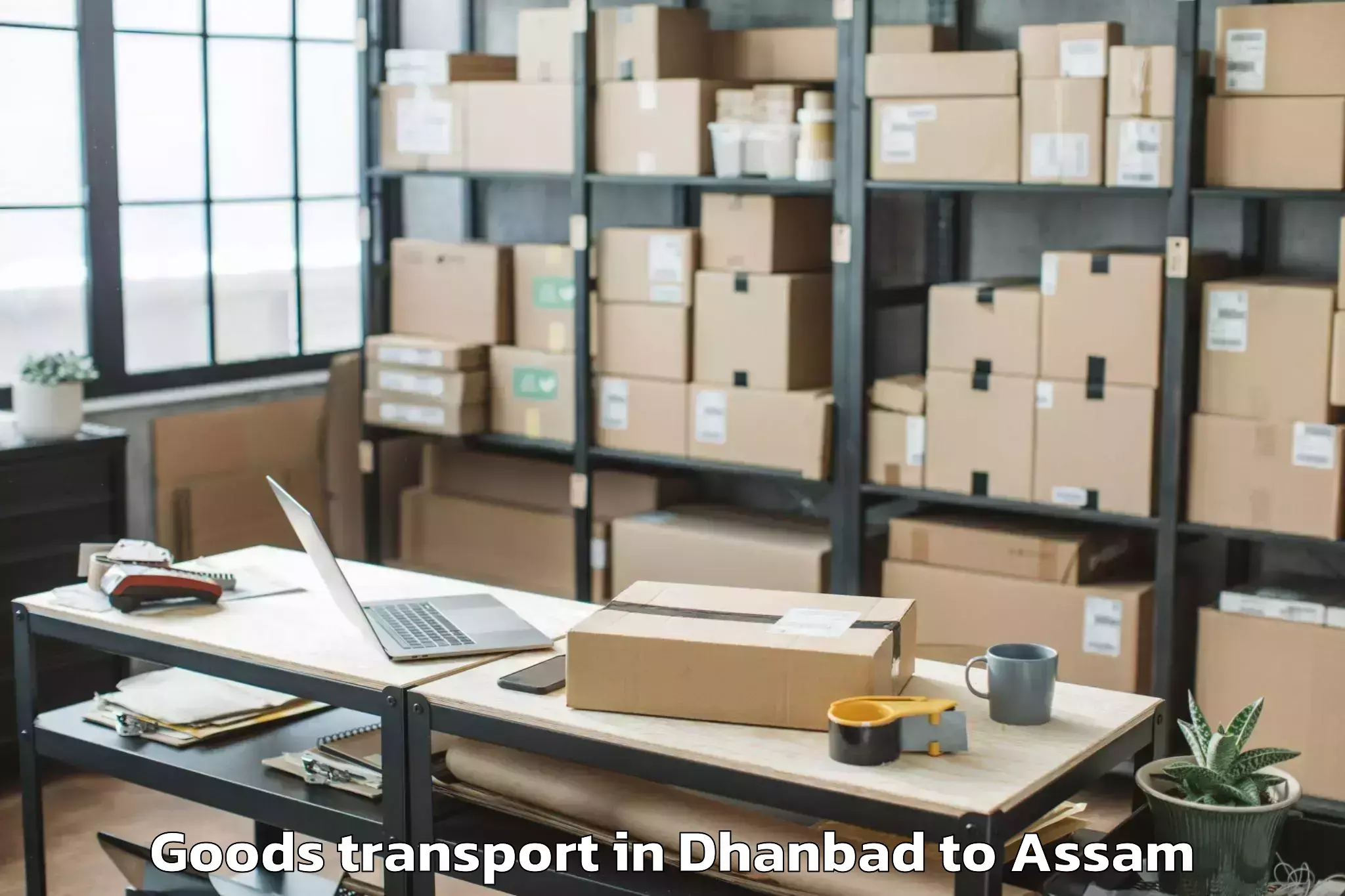 Book Dhanbad to Morigaon Goods Transport Online